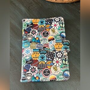 Life is Good travel passport cover with a multi-color sticker collage design.
